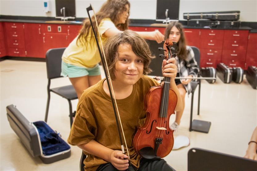 A student plays an instrument